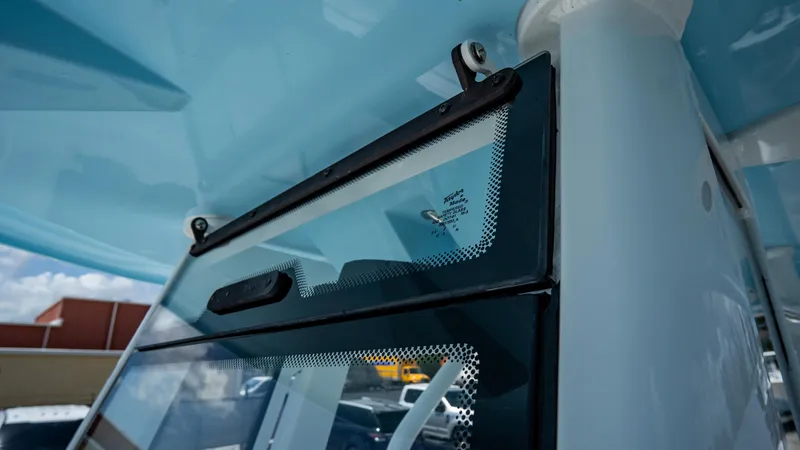 Slide: The Image of Close-up of 2025 Tidewater 232 CC Adventure boat windshield and hardtop. - 14