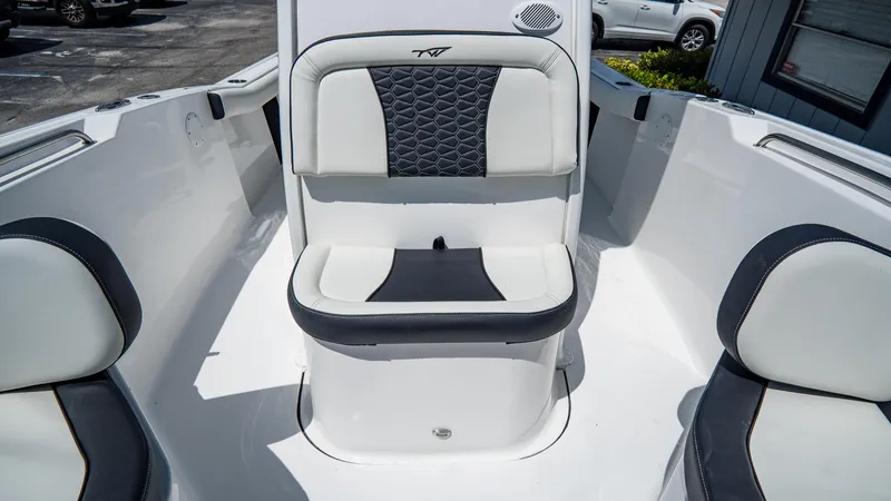 Slide: The Image of 2025 Tidewater 232 CC Adventure boat interior seating area. - 16