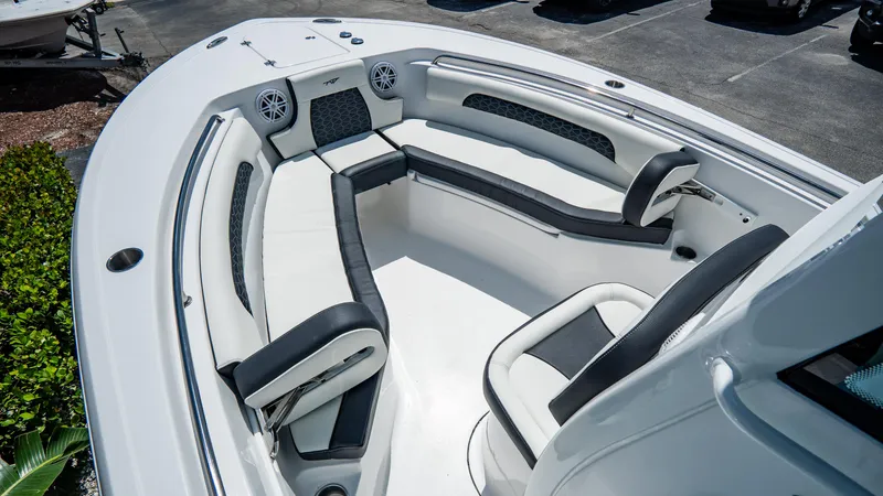 Slide: The Image of 2025 Tidewater 232 CC Adventure boat with spacious seating area and modern design. - 17