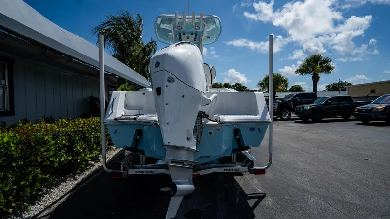 Slide: The Image of 2025 Tidewater 232 CC Adventure boat on trailer, rear view. - 2