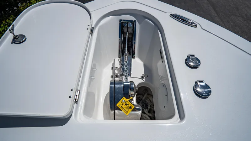 Slide: The Image of 2025 Tidewater 232 CC Adventure anchor locker with open hatch. - 21