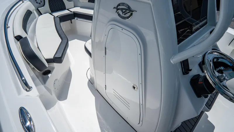 Slide: The Image of 2025 Tidewater 232 CC Adventure boat interior with seating and storage. - 22