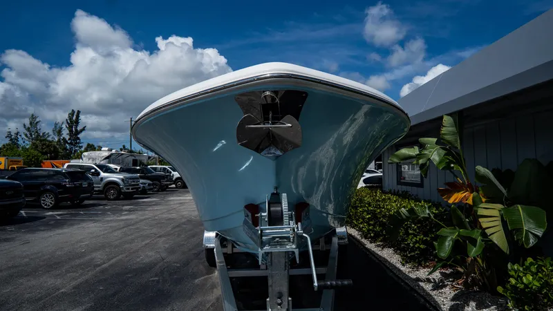 Slide: The Image of 2025 Tidewater 232 CC Adventure boat on trailer in parking lot. - 4