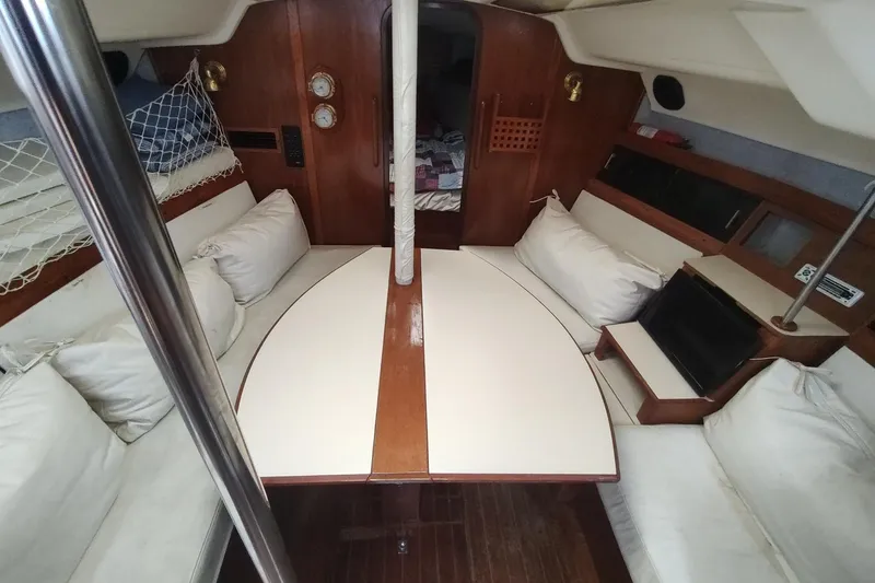 Slide: The Image of Interior of 1987 Hunter 37 Legend sailboat with cozy seating and wooden accents. - 41
