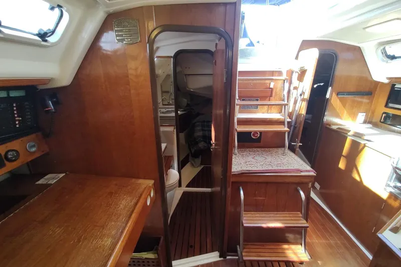 Slide: The Image of Interior of 1987 Hunter 37 Legend sailboat with wooden finishes and compact design. - 38