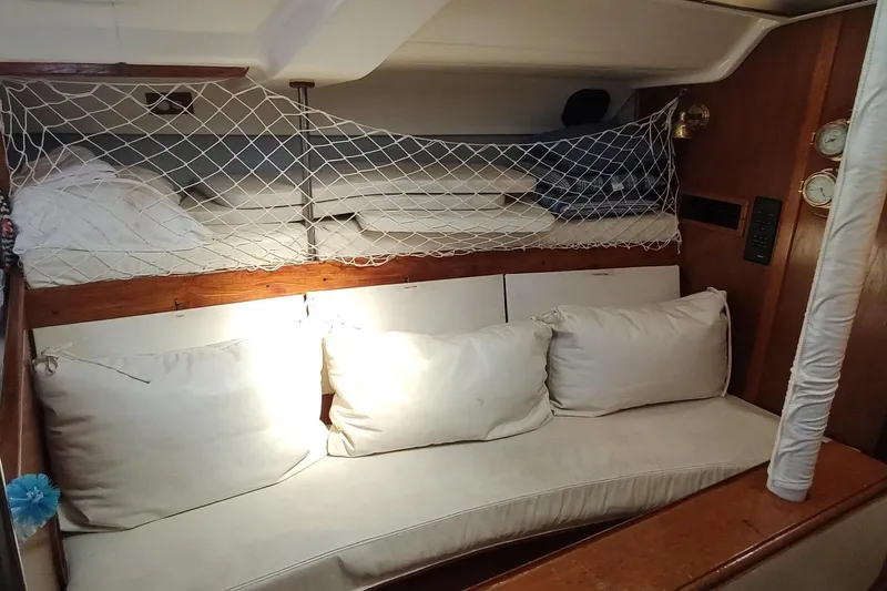 Slide: The Image of Interior of 1987 Hunter 37 Legend sailboat with cozy seating and netted storage. - 43