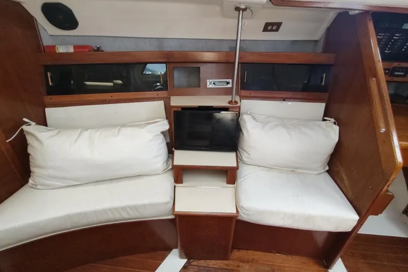 Slide: The Image of Interior of 1987 Hunter 37 Legend sailboat with cozy seating and wooden accents. - 45