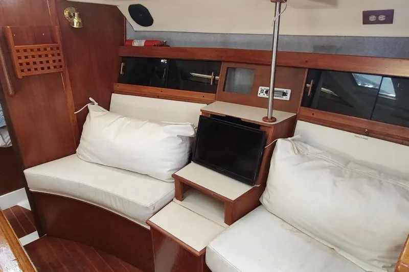 Slide: The Image of Interior of 1987 Hunter 37 Legend sailboat with cozy seating and wooden accents. - 44