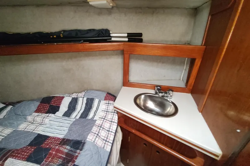 Slide: The Image of Cozy cabin interior of 1987 Hunter 37 Legend with bed and sink. - 51