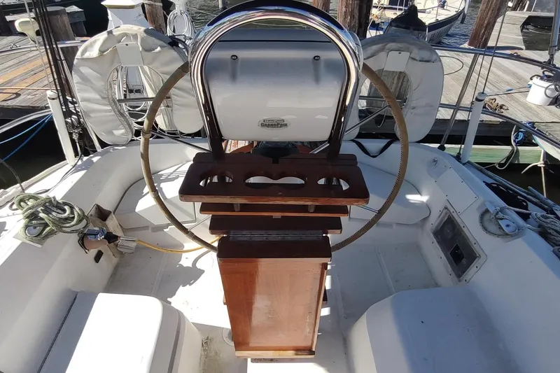 Slide: The Image of Cockpit of 1987 Hunter 37 Legend sailboat with steering wheel and navigation equipment. - 9