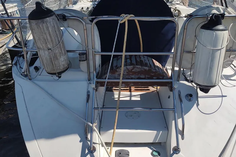 Slide: The Image of 1987 Hunter 37 Legend yacht deck with safety equipment and railing. - 4