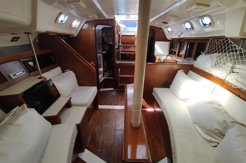 Slide: The Image of Interior of 1987 Hunter 37 Legend sailboat with wooden finishes and cozy seating. - 46