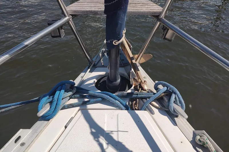 Slide: The Image of Bow of 1987 Hunter 37 Legend sailboat with ropes and anchor on deck. - 20