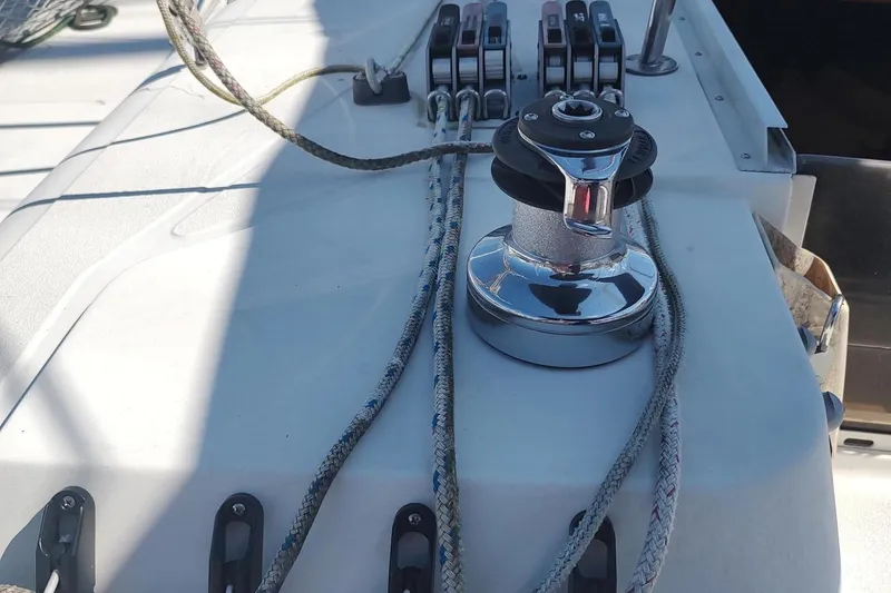 Slide: The Image of Sailing equipment on 1987 Hunter 37 Legend yacht deck, featuring winch and ropes. - 13