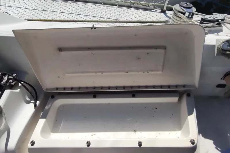 Slide: The Image of Open storage compartment on 1987 Hunter 37 Legend sailboat deck. - 7