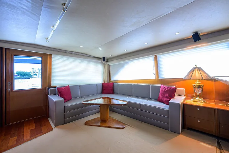 Slide: The Image of Luxurious interior of 2001 Viking 65 Enclosed Bridge yacht with elegant seating and decor. - 17
