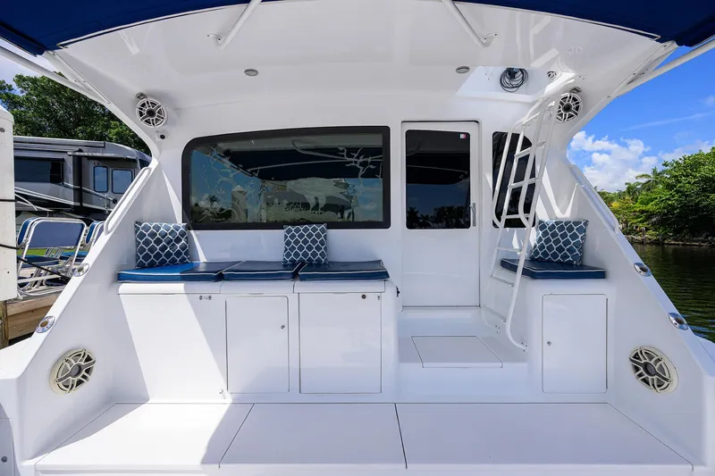 Slide: The Image of 2001 Viking 65 Enclosed Bridge yacht deck with seating and storage. - 25