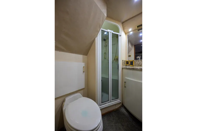 Slide: The Image of Bathroom interior of 2001 Viking 65 Enclosed Bridge yacht with shower and toilet. - 31