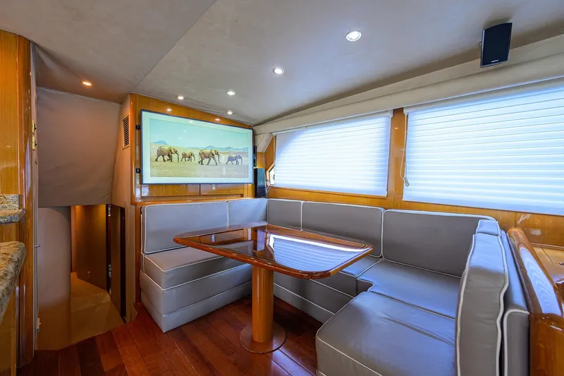 Slide: The Image of Luxurious interior of 2001 Viking 65 Enclosed Bridge yacht with elegant seating and decor. - 33