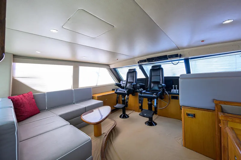 Slide: The Image of Luxurious interior of 2001 Viking 65 Enclosed Bridge yacht with seating and helm chairs. - 37