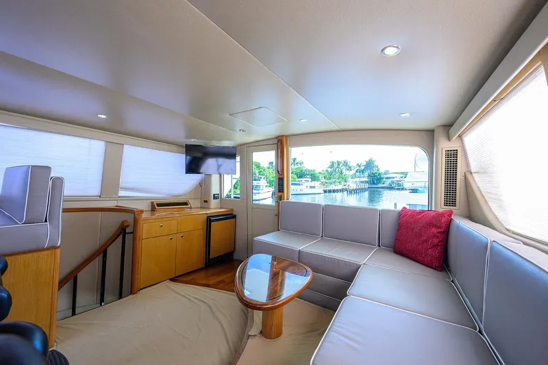 Slide: The Image of Luxurious interior of 2001 Viking 65 Enclosed Bridge yacht with modern seating and scenic view. - 39