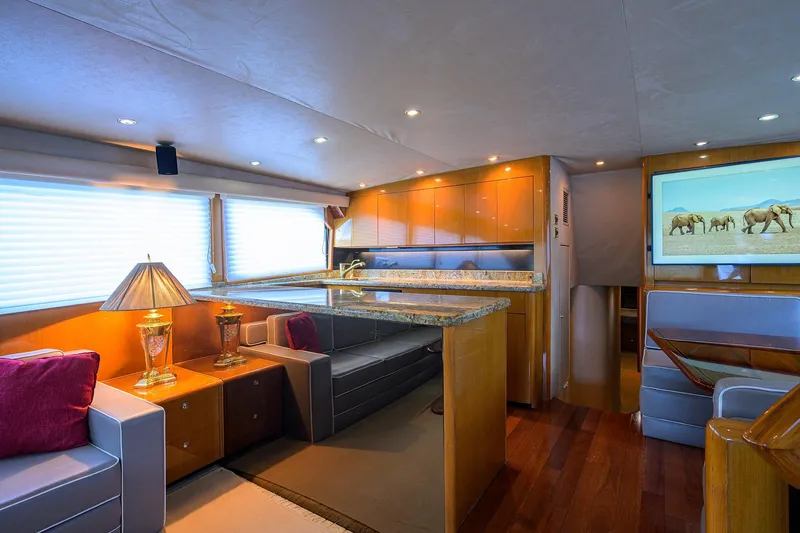 Slide: The Image of Luxurious interior of 2001 Viking 65 Enclosed Bridge yacht with elegant furnishings and decor. - 70