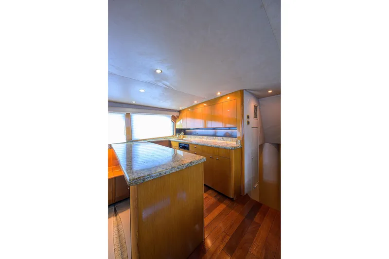 Slide: The Image of Interior of 2001 Viking 65 Enclosed Bridge yacht with modern kitchen design. - 71