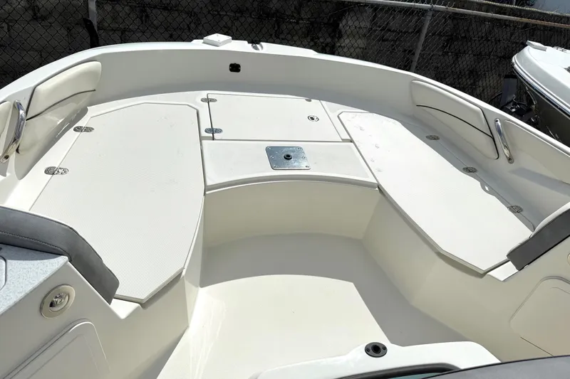 Slide: The Image of 2023 Stingray 206cc boat interior with spacious seating and storage compartments. - 11