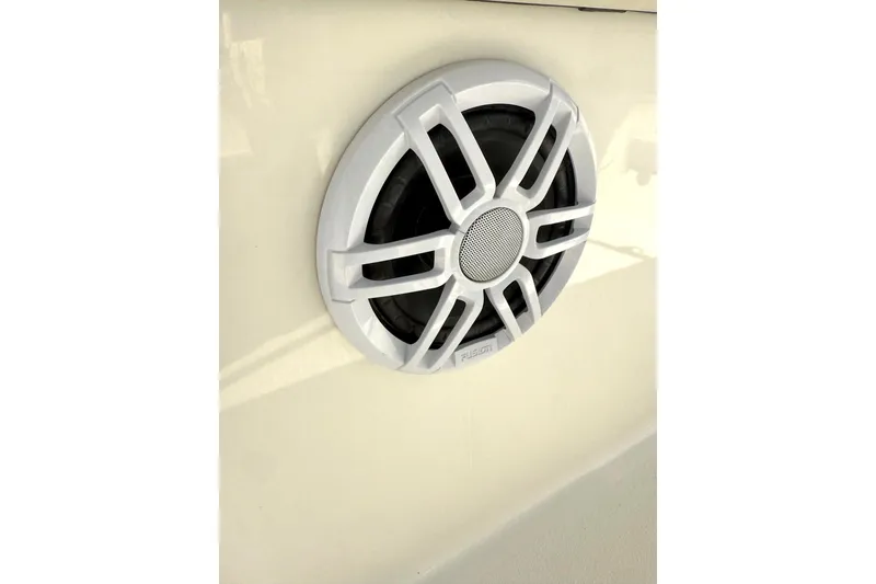 Slide: The Image of White speaker on 2023 Stingray 206cc boat exterior. - 15