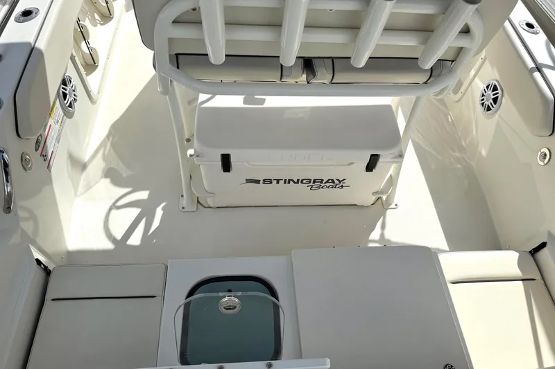 Slide: The Image of 2023 Stingray 206cc boat interior with seating and storage compartments. - 7