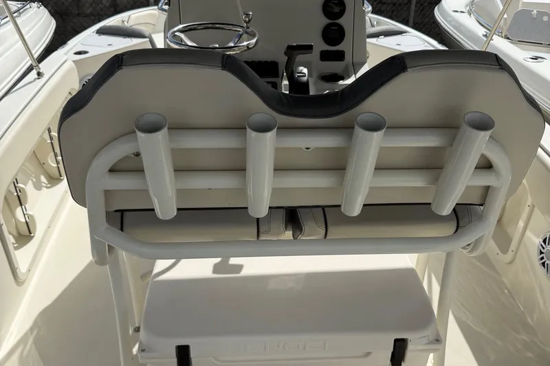Slide: The Image of 2023 Stingray 206cc boat interior with rod holders and steering console. - 8