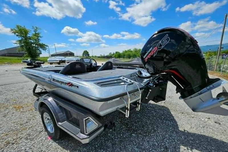 Slide: The Image of 2025 Ranger Z518 Cup-Equipped boat with powerful Mercury engine, parked outdoors. - 16