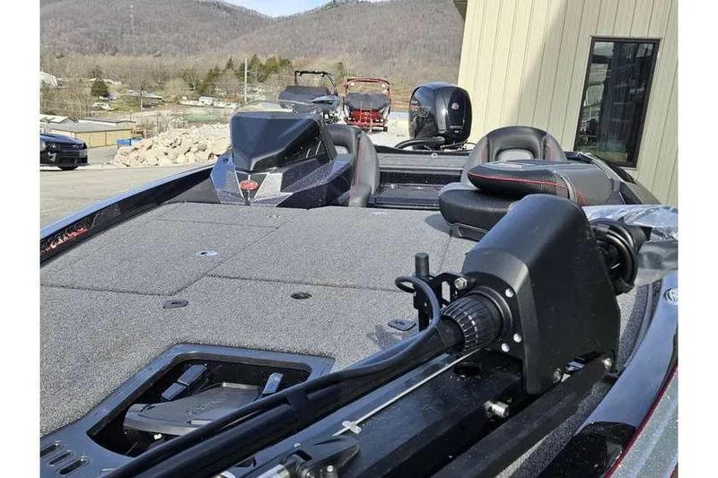 Slide: The Image of 2025 Ranger Z518 Cup-Equipped boat with advanced features, parked outdoors. - 5