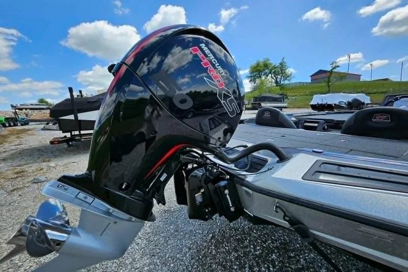 Slide: The Image of 2025 Ranger Z518 Cup-Equipped boat with Mercury Pro XS engine, parked outdoors under blue sky. - 8