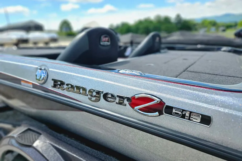 Slide: The Image of 2025 Ranger Z518 Cup-Equipped boat, close-up of logo and sleek design. - 9