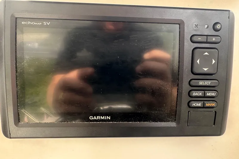 Slide: The Image of Garmin echoMAP SV on 1998 Rampage 28 Express boat dashboard. - 14