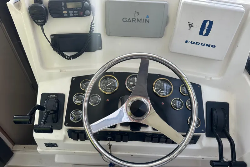 Slide: The Image of Control panel of a 1998 Rampage 28 Express boat with Garmin and Furuno equipment. - 4