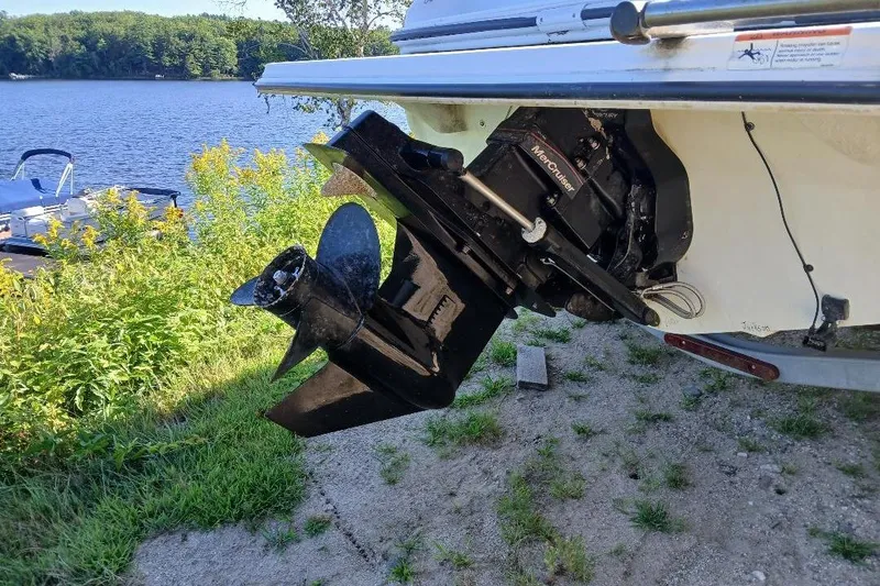 Slide: The Image of 2007 Glastron GT 185 boat with MerCruiser engine by a lakeside. - 6