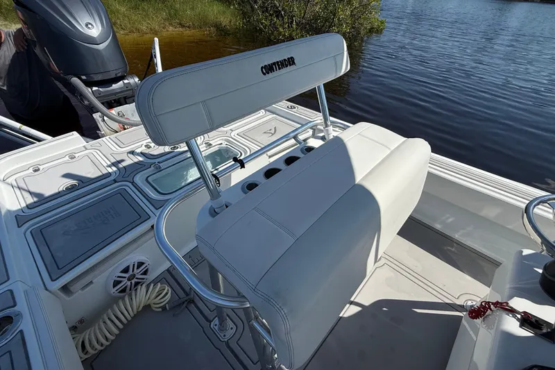 Slide: The Image of 2024 Contender 26 Bay boat interior with seating and storage compartments. - 16