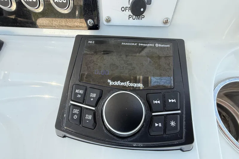 Slide: The Image of Rockford Fosgate audio system on 2024 Contender 26 Bay boat dashboard. - 22