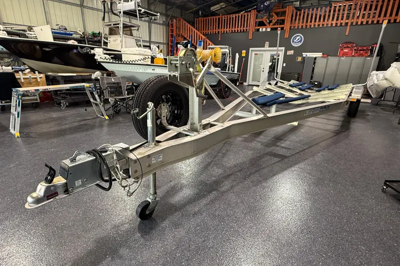 Slide: The Image of Boat trailer in a garage, designed for 2024 Contender 26 Bay model. - 50