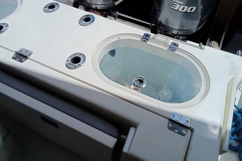 Slide: The Image of 2014 Cobia 296 Center Console boat with livewell and Yamaha 300 engine. - 38