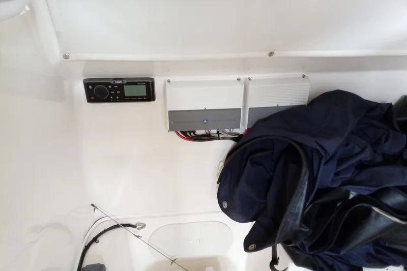 Slide: The Image of 2014 Cobia 296 Center Console interior with electronics and storage area. - 43