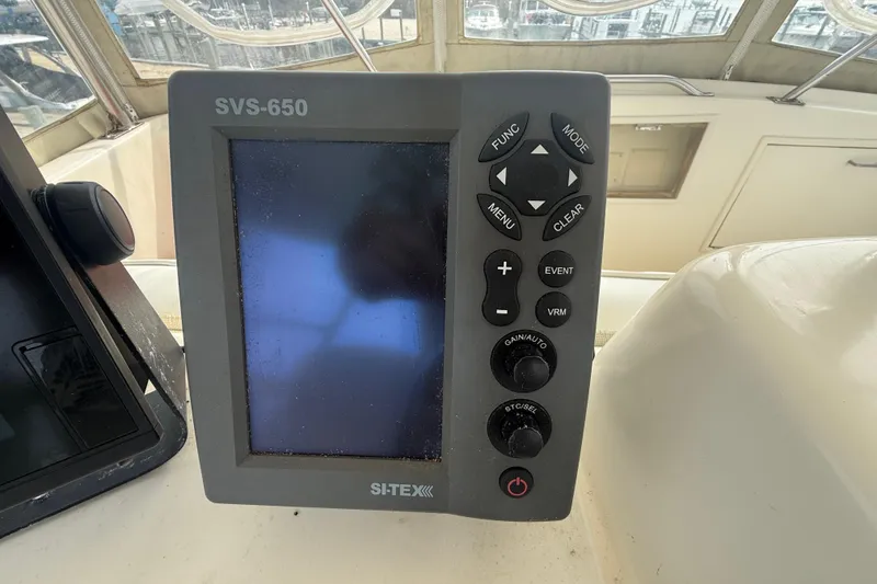 Slide: The Image of Boat navigation system on 1986 Ocean Yachts 38 Super Sport, featuring SI-TEX SVS-650 display. - 12