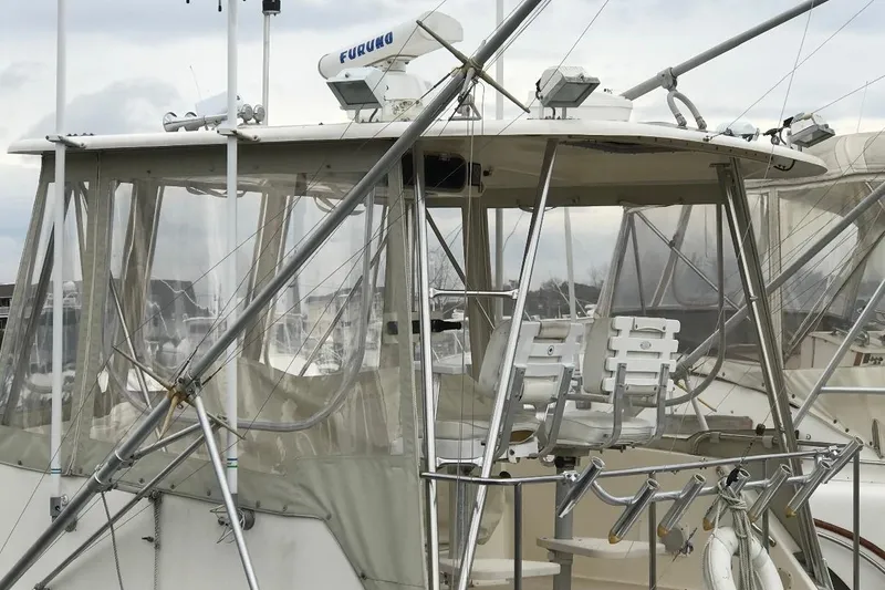 Slide: The Image of 1986 Ocean Yachts 38 Super Sport boat with fishing equipment and radar system. - 16