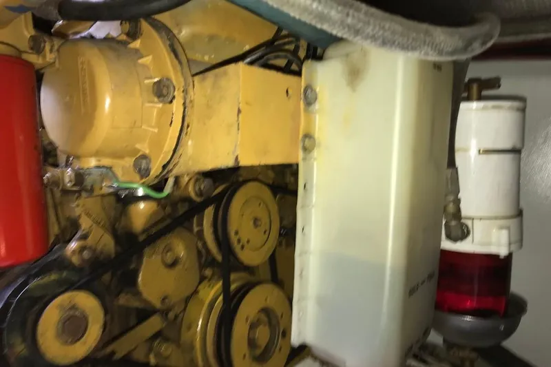 Slide: The Image of Engine components of a 1986 Ocean Yachts 38 Super Sport boat, featuring belts and filters. - 20