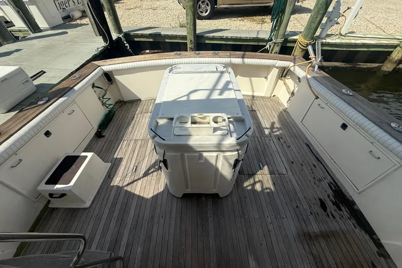 Slide: The Image of 1986 Ocean Yachts 38 Super Sport deck with storage and seating area. - 6