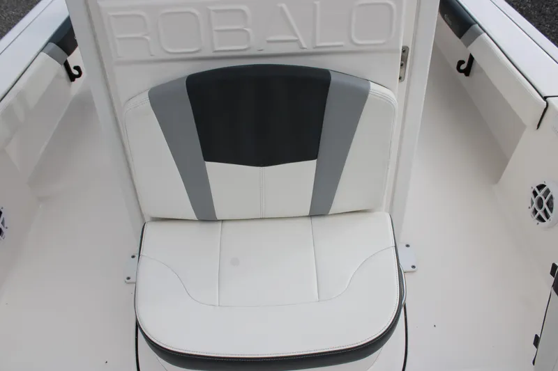 Slide: The Image of 2023 Robalo 226 Cayman boat seat with white and gray upholstery. - 13