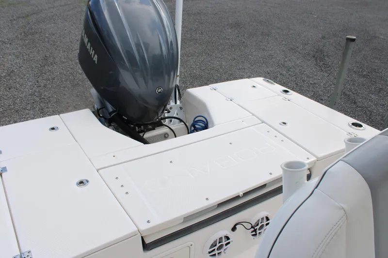 Slide: The Image of 2023 Robalo 226 Cayman boat with Yamaha outboard engine, rear deck view. - 16