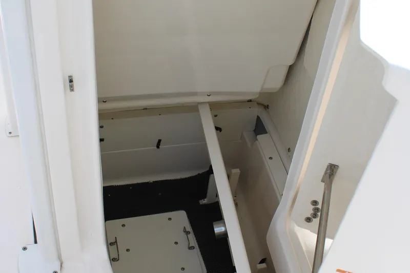 Slide: The Image of 2023 Robalo 226 Cayman storage compartment interior view. - 24